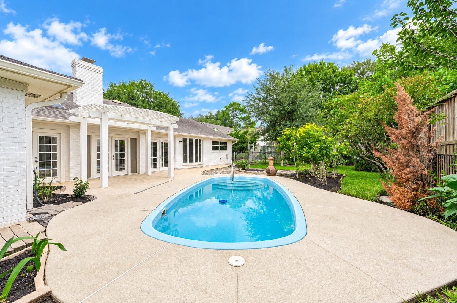 109 Dorado Drive, Friendswood, TX 77546 Additional pool view showcasing the spacious patio area.