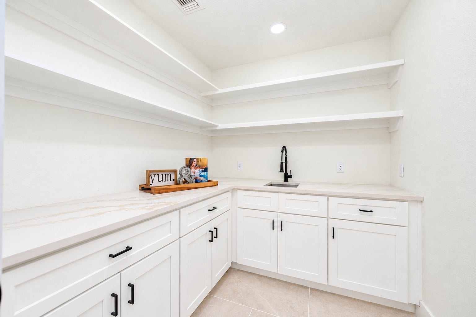 109 Dorado Drive, Friendswood, TX 77546 Walk-in pantry with built-in cabinetry, counter space, and ample storage.