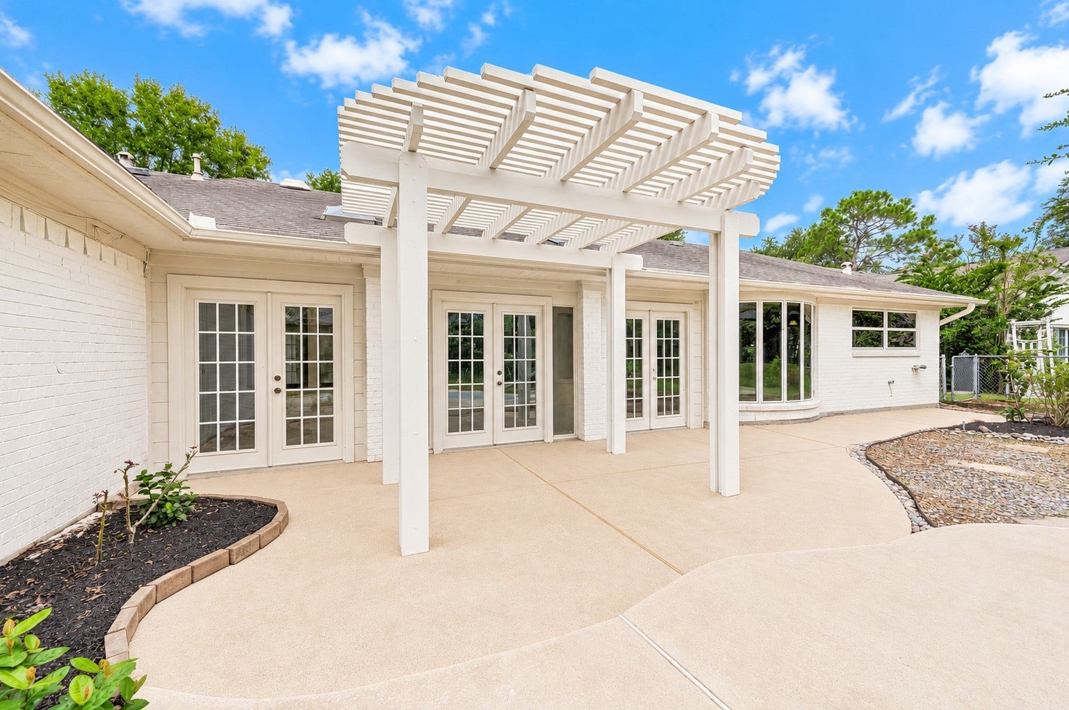 109 Dorado Drive, Friendswood, TX 77546 Rear exterior featuring multiple windows overlooking the backyard.