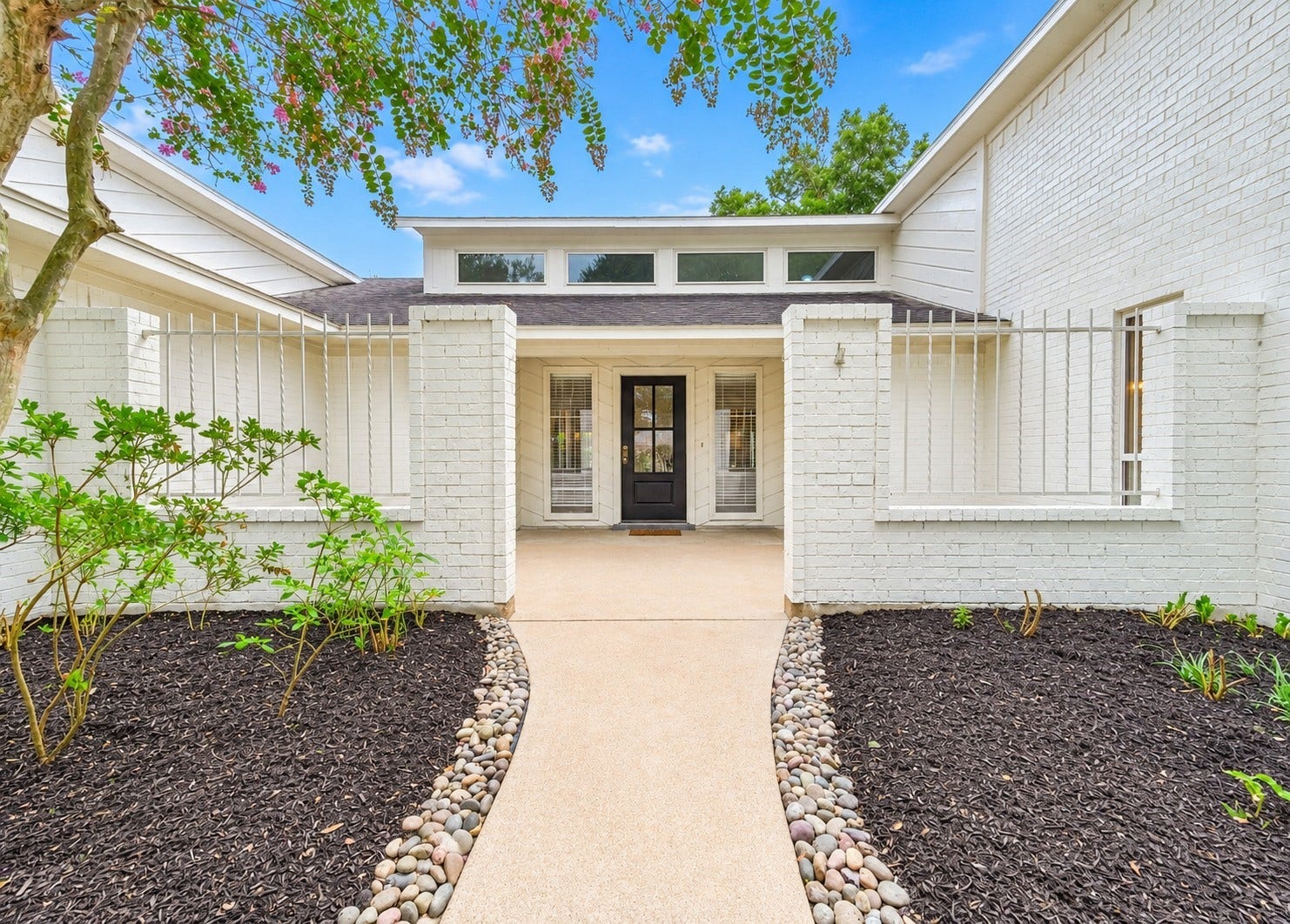 109 Dorado Drive, Friendswood, TX 77546 Inviting covered front entry with landscaped walkway.