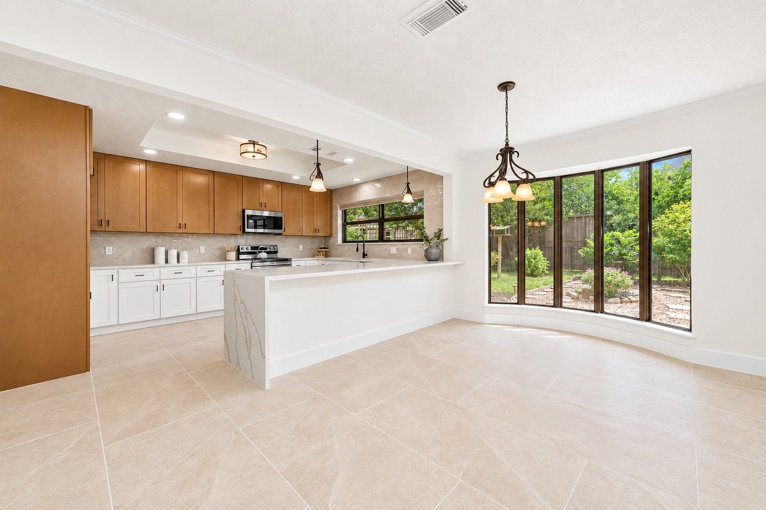 109 Dorado Drive, Friendswood, TX 77546 Bright kitchen with center island and abundant natural light.