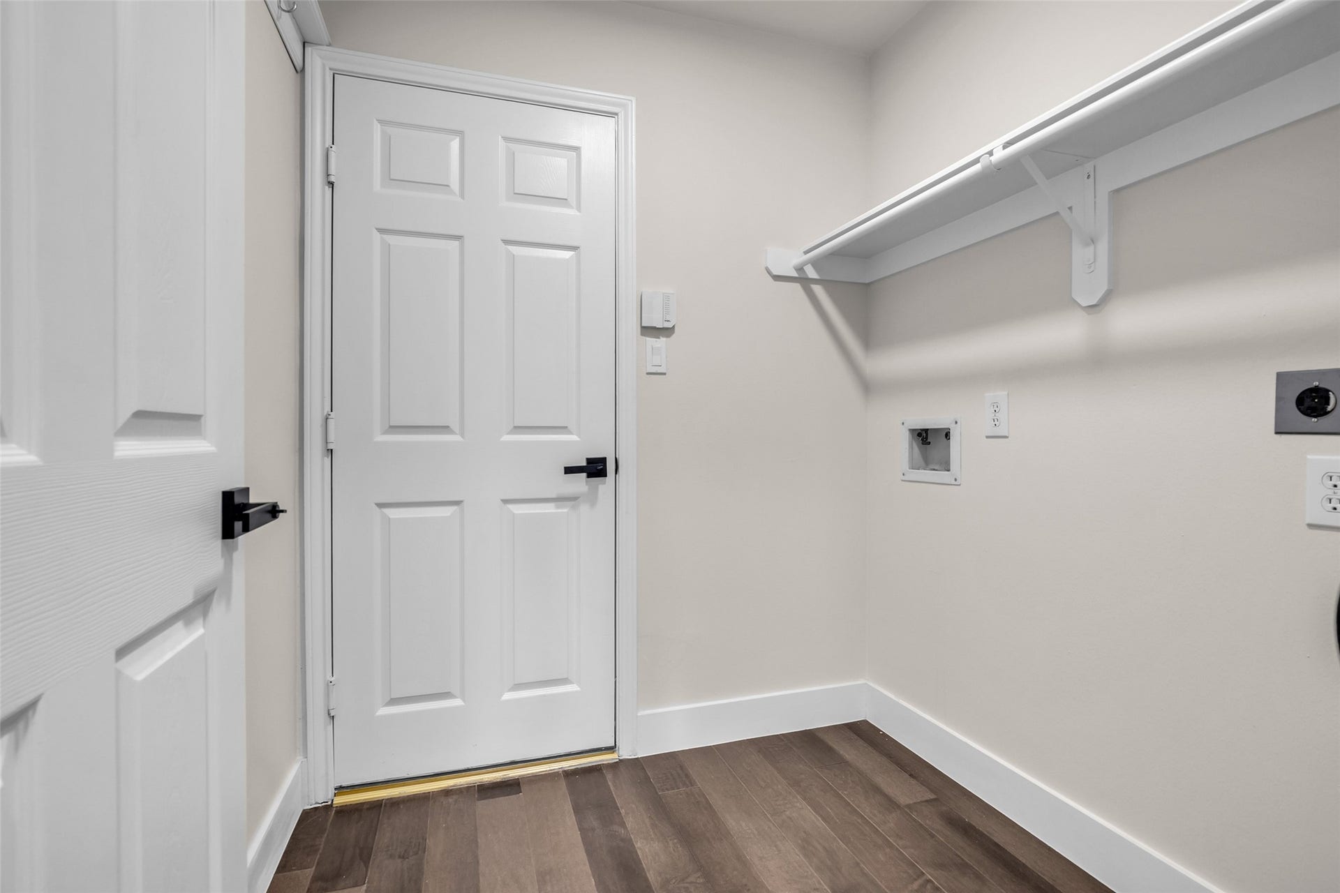 22002 Madera Canyon Court, Richmond, TX 77469 Access your laundry area and garage entry, perfect for effortless daily living.