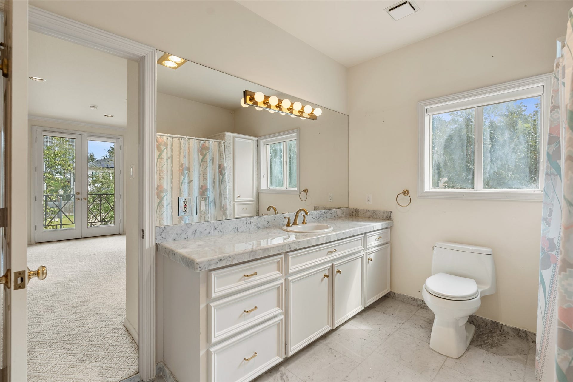 3923 Childress Street, #A, Houston, TX 77005 Large secondary bathroom featuring a spacious vanity with marble countertops.