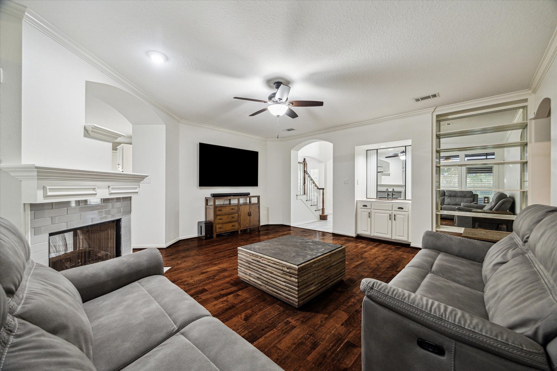 4107 Wentworth Drive, Fulshear, TX 77441 Come sit by the fireplace and enjoy a cozy moment.