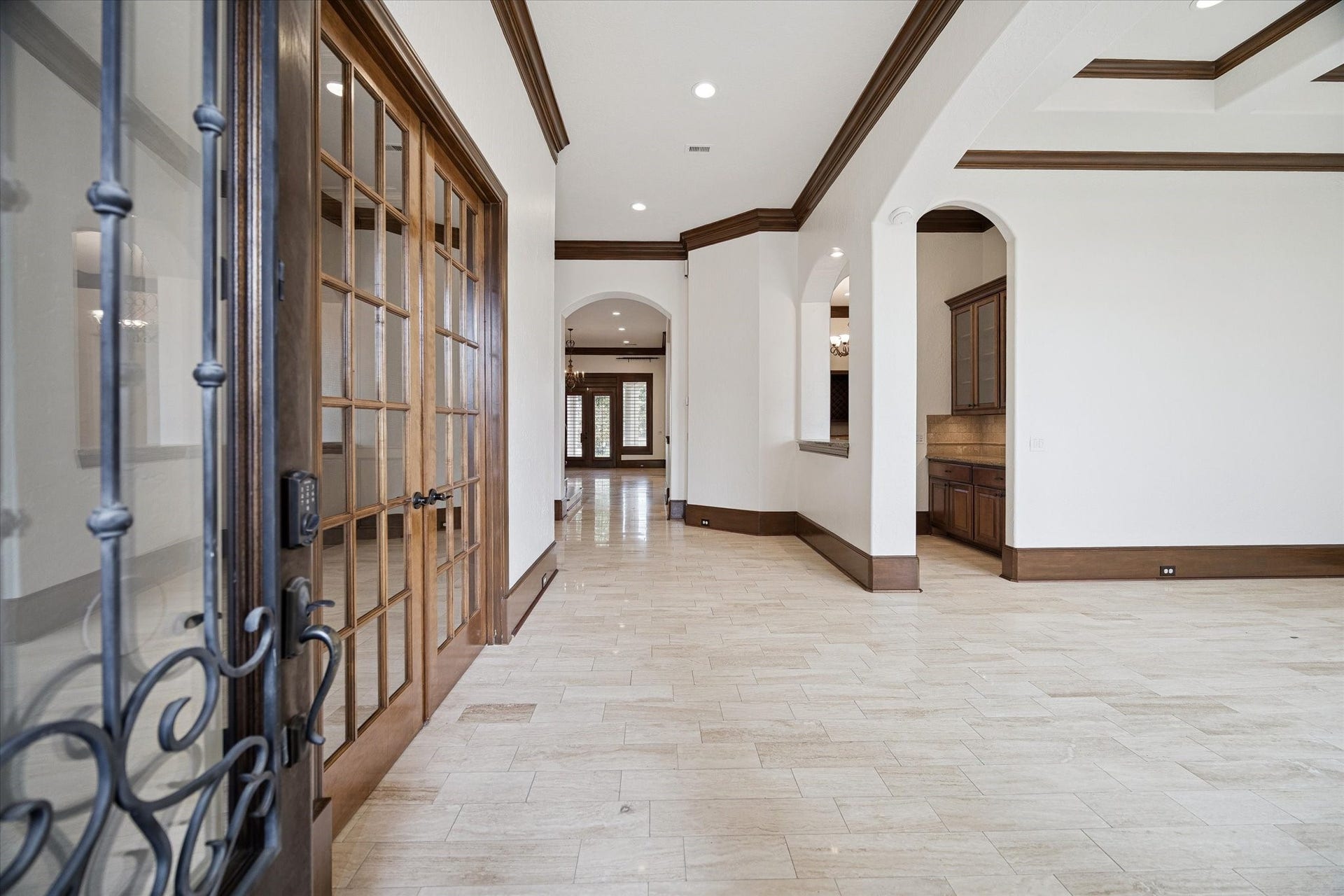REPAINTED! Formal entry open to the formal dining room and formal study. Skip trowel, freshly painted walls and stained crown moulding and baseboards.