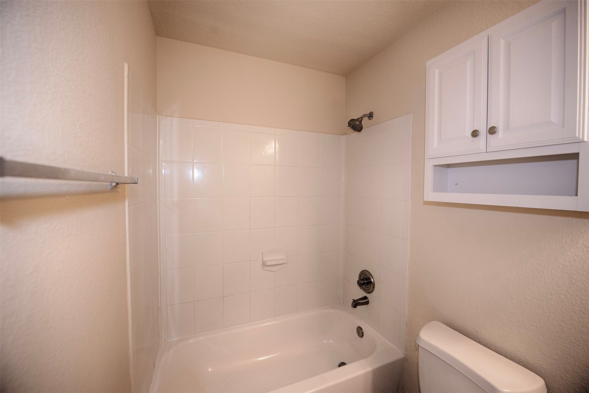 106 Easton Glen Lane, Dickinson, TX 77539 View of the bathroom showing the combo bath and shower as well as additional storage.