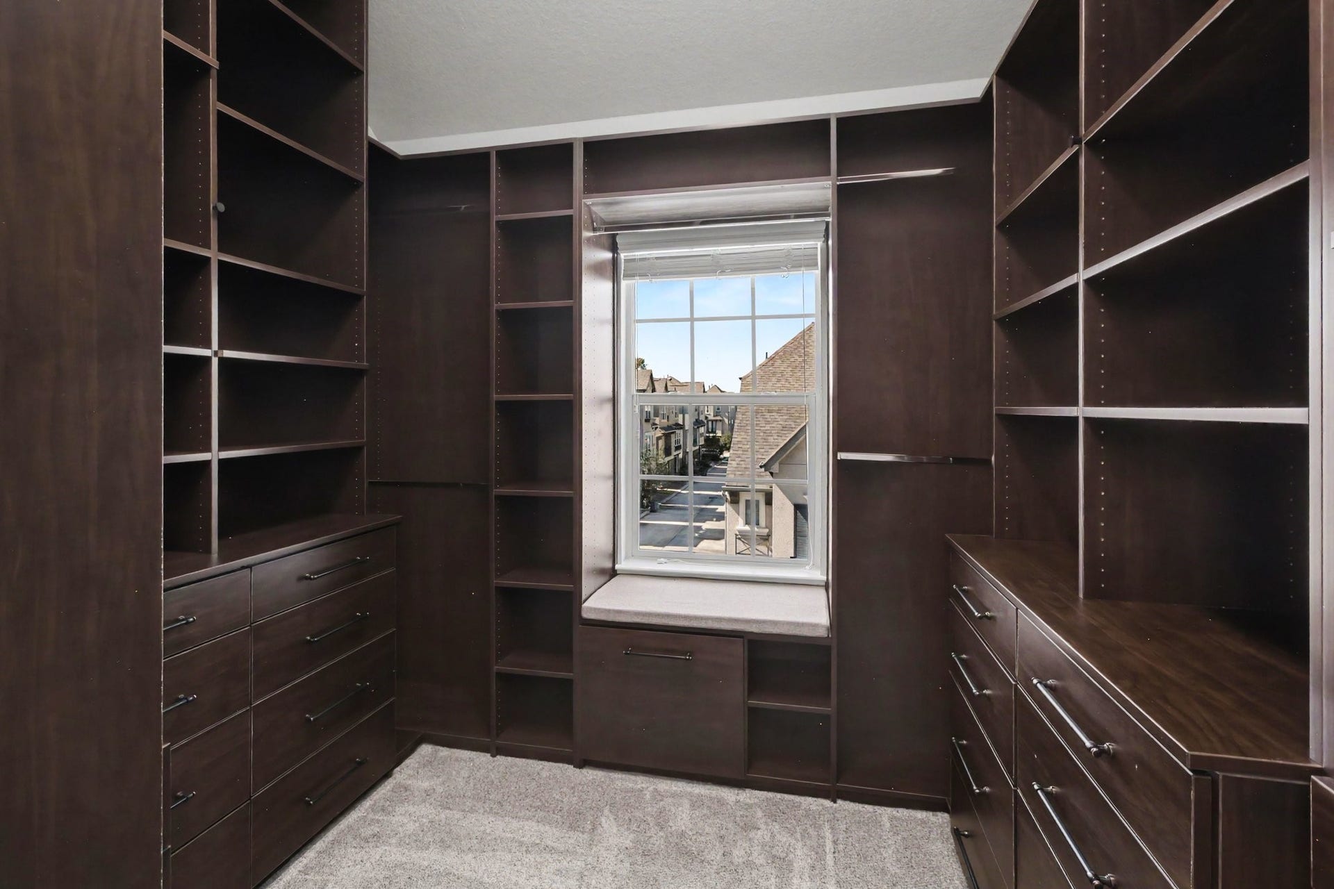 1506 Peyton Oaks Place, Houston, TX 77043 Custom-designed walk-in closet with abundant shelving, cabinetry, and drawer storage