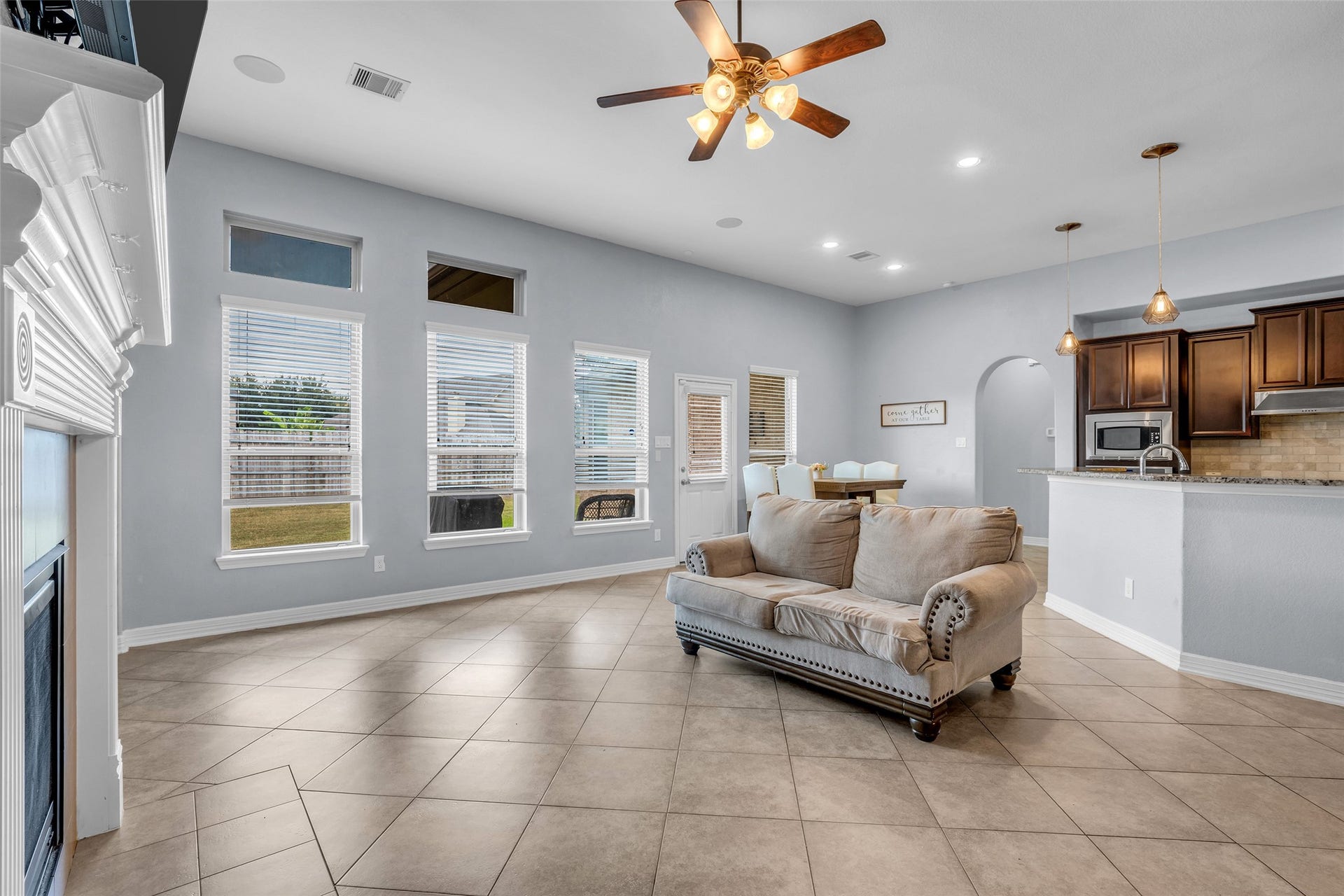 7 Ember Branch Drive, Missouri City, TX 77459 Open sightlines from the living room to the kitchen and dining area keep everyone connected.