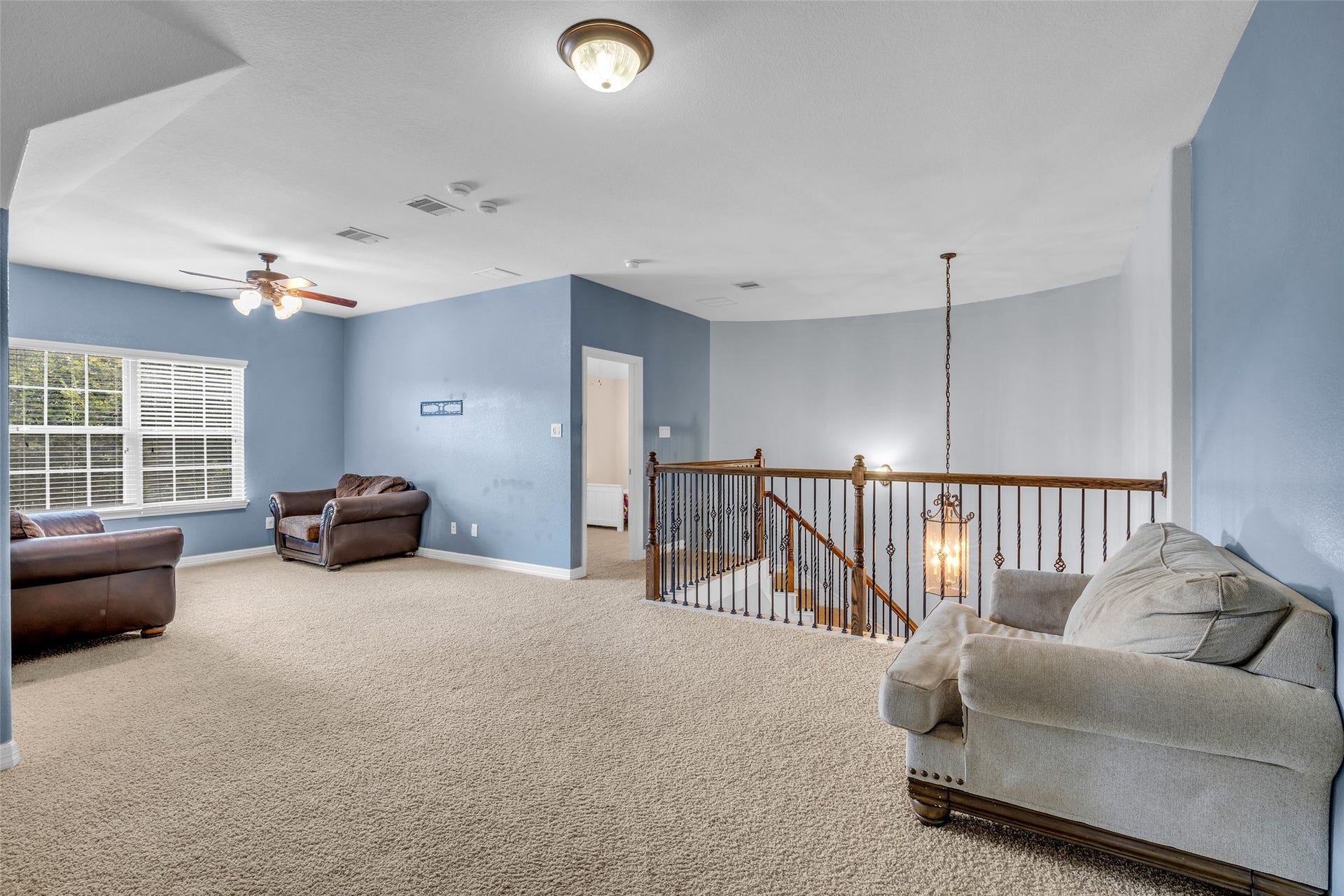 7 Ember Branch Drive, Missouri City, TX 77459 Game nights, movie marathons or a media setup: the upstairs game room overlooks the curved staircase.
