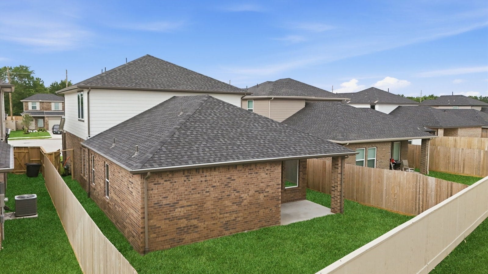 3406 Horseshoe Trail Lane, League City, TX 77511 Large fenced-in backyard with a covered patio, perfect for outdoor entertaining.