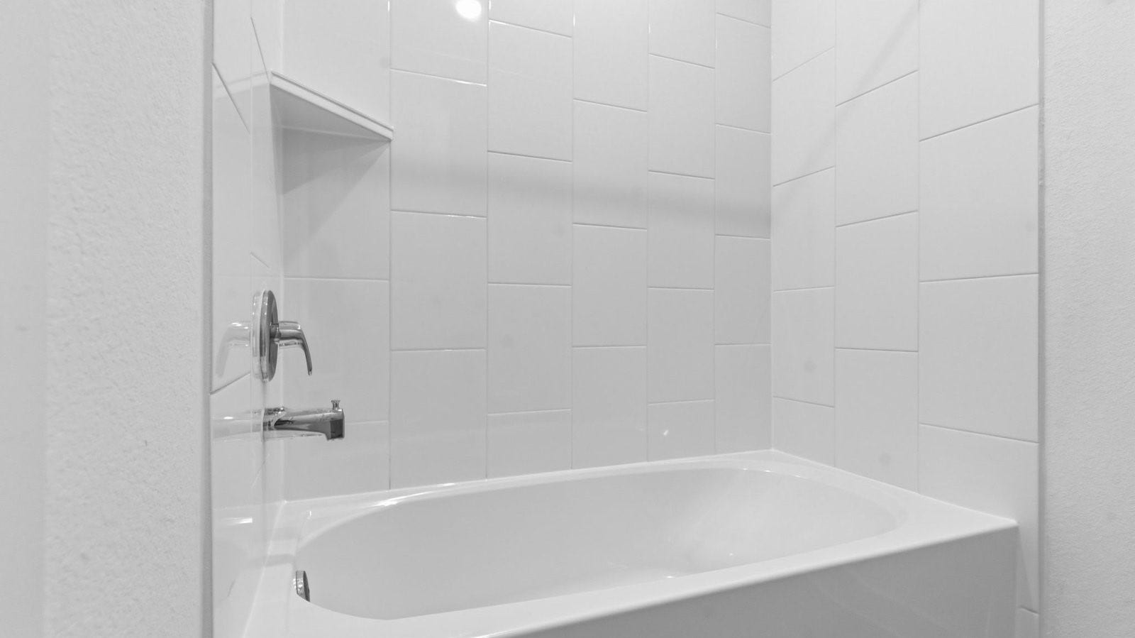 3406 Horseshoe Trail Lane, League City, TX 77511 A well-designed bathroom equipped with quartz countertops, a standing tub, and a single vanity.