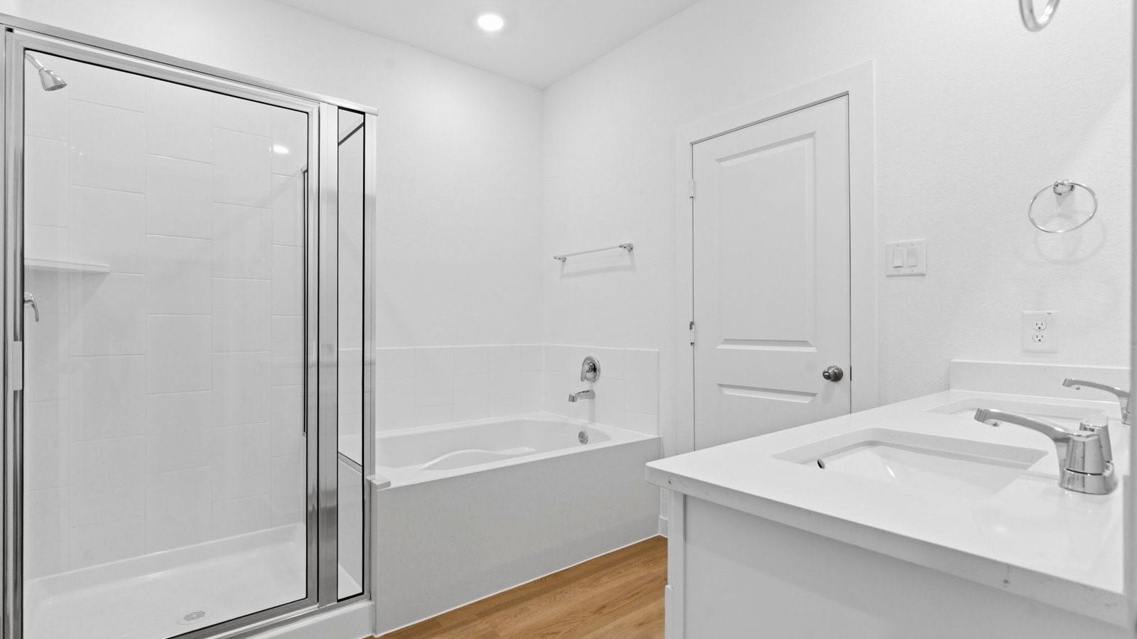 3406 Horseshoe Trail Lane, League City, TX 77511 Modern primary bathroom with double vanities, quartz countertops, and a glass-enclosed shower with a walk-in closet.