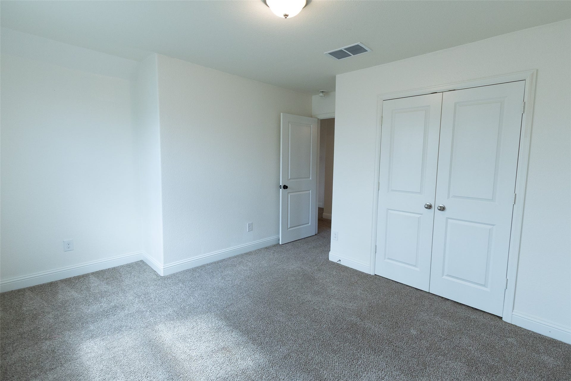 FOURTH BEDROOM WITH DUAL CLOSET DOOR