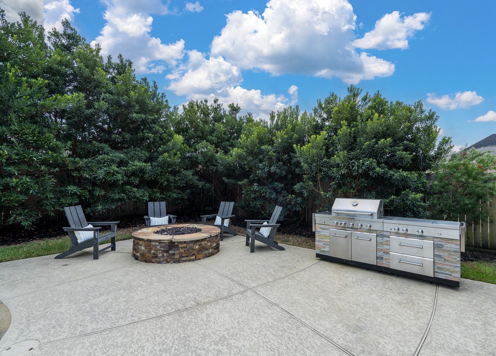 Ready for burgers and smores? The fabulous gas firepit is just the right spot to cozy up for the evening and the outdoor grill with side burners and storage stays with the home!