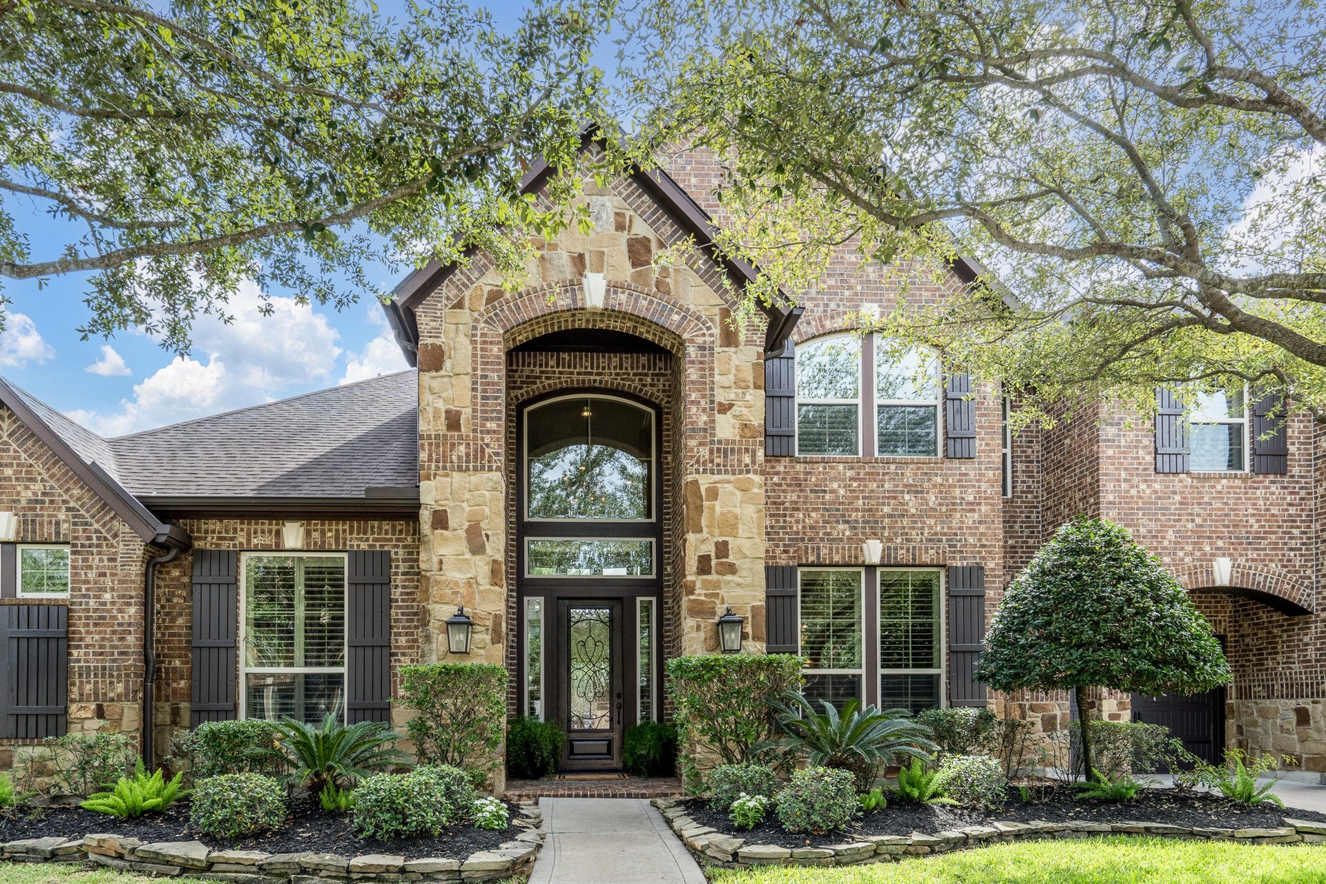 Meticulously maintained, lush landscaping and mature tress offer plenty of curb appeal!