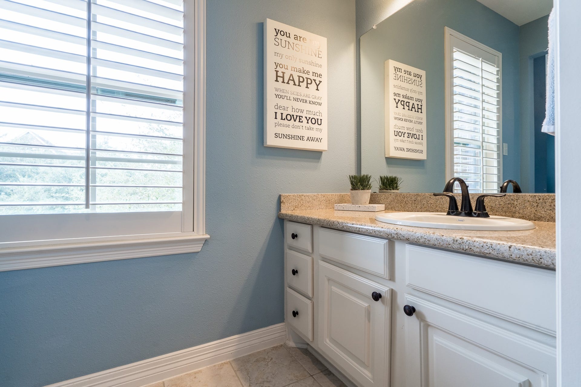 The private vanities are complete with large mirrors and plenty of cabinet and drawer space for your storage needs!
