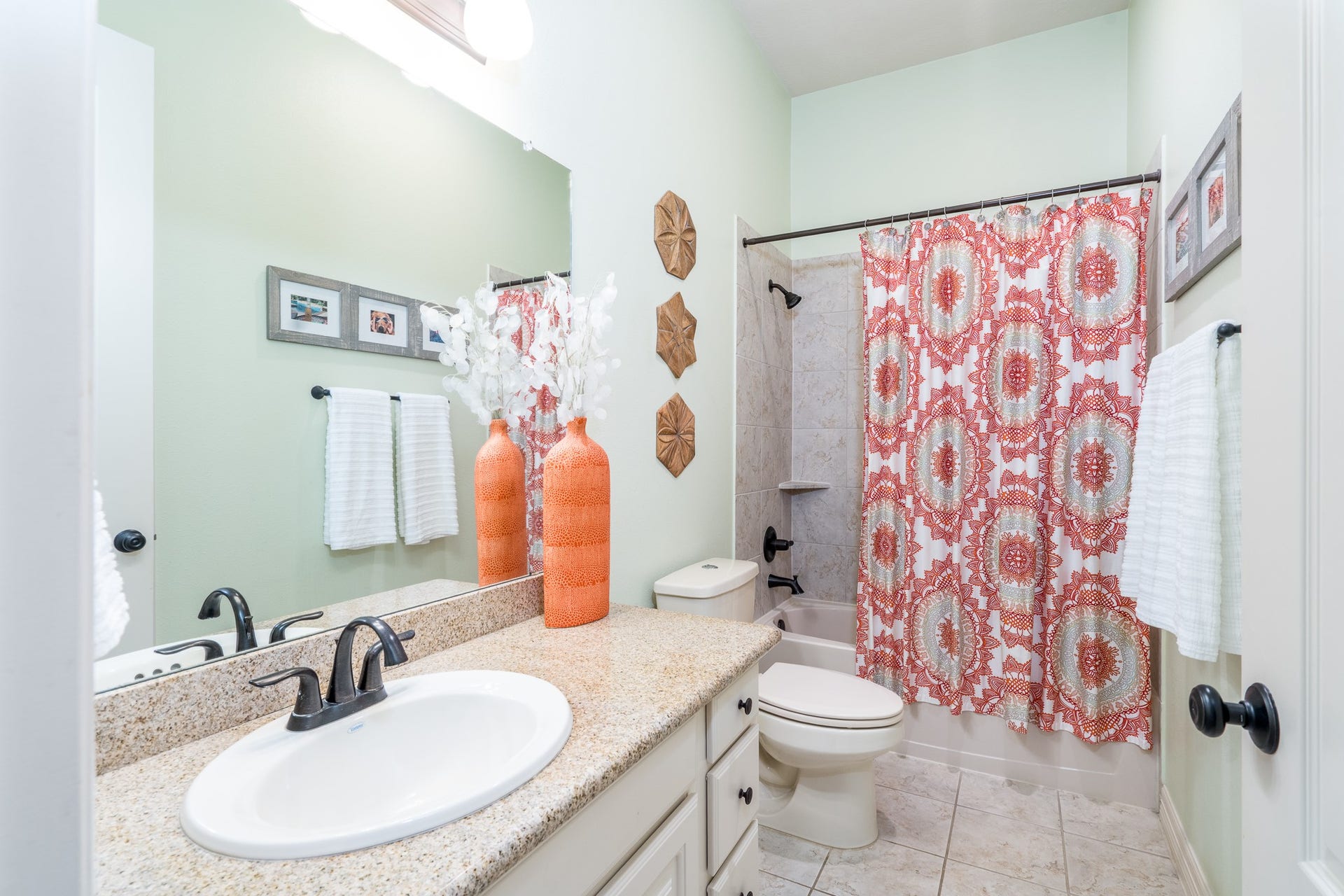 The private full bath with shower/tub combo and tile surround awaits residents and guests to start or end their day!