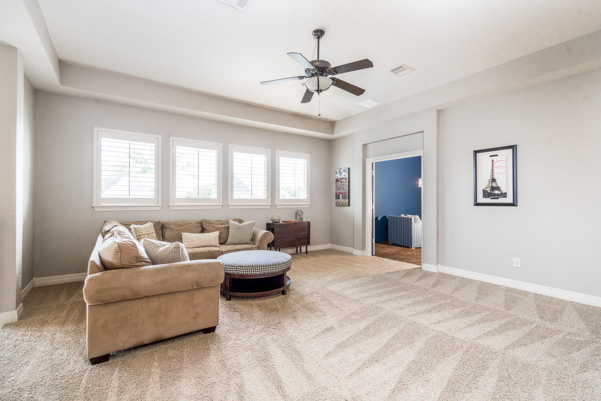Once upstairs you will find this HUGE game room! It offers plenty of room for a pool table, workout equipment or additional TV viewing area!