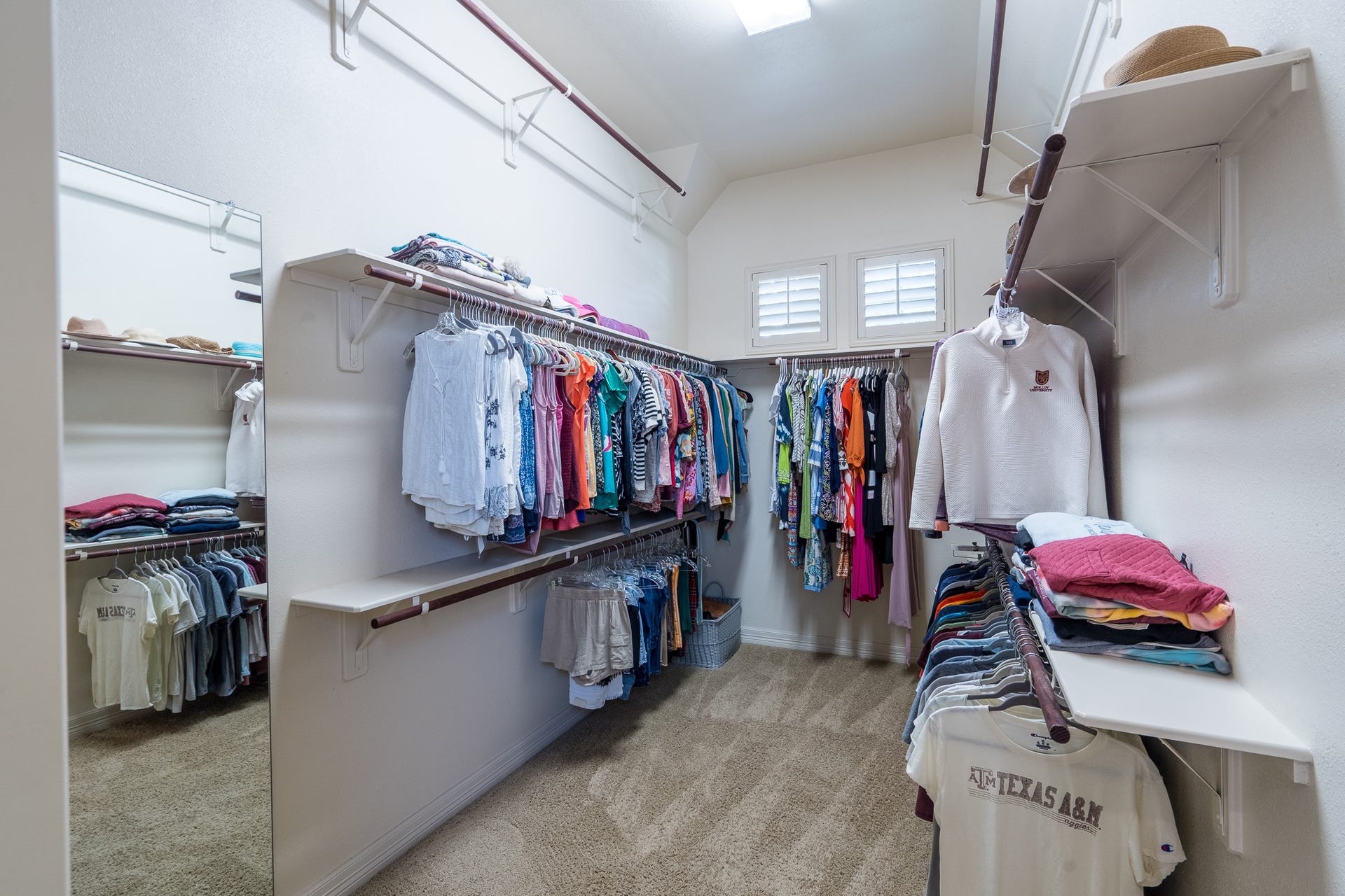 Dual walk-in closets are located off the primary bath and offer plenty of space for you to organize your belongings in style!