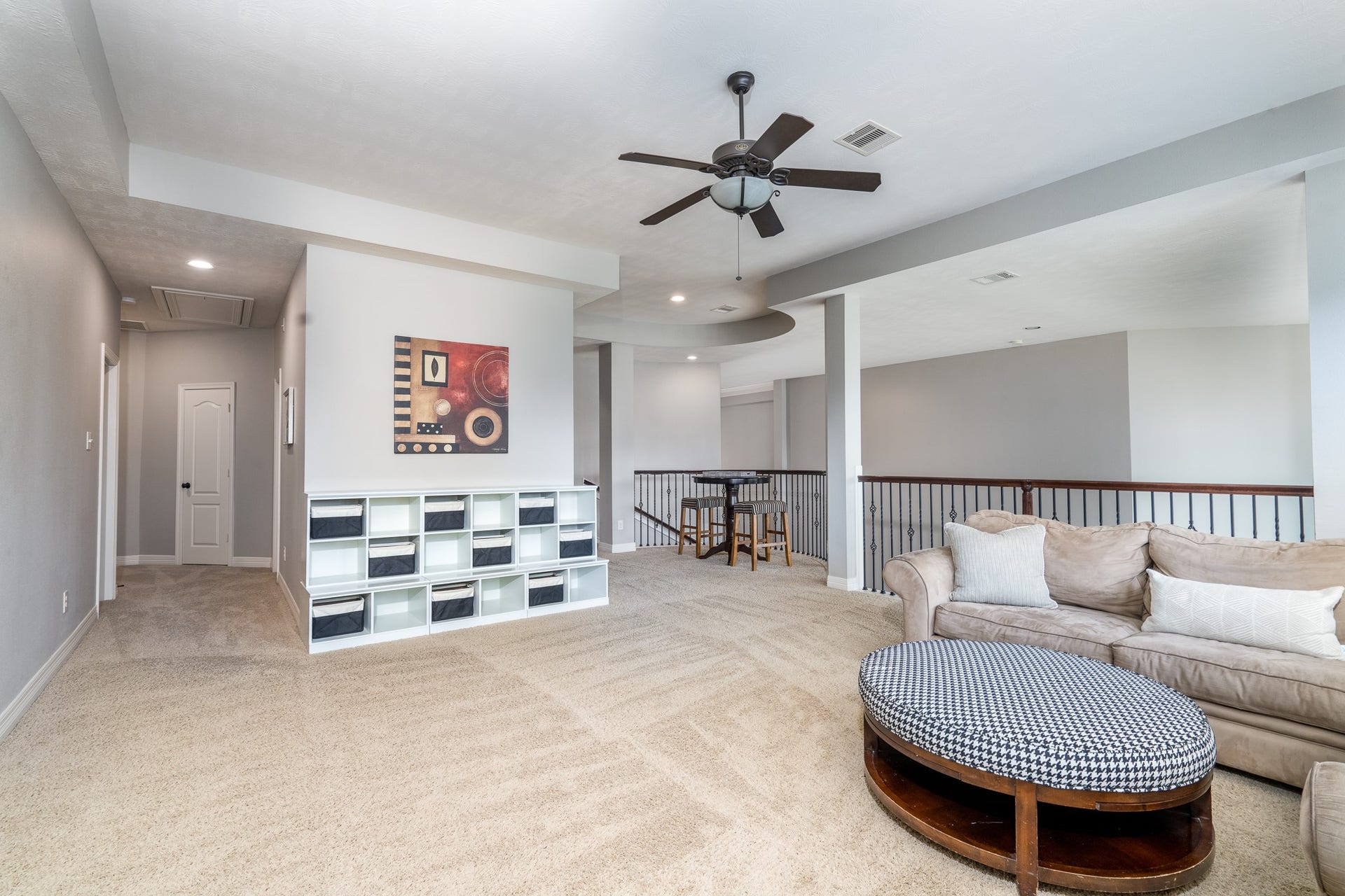 Imagine game nights in this flexible space! An added bonus is the nook in the rear of the balcony, perfect for a bar or puzzle table!