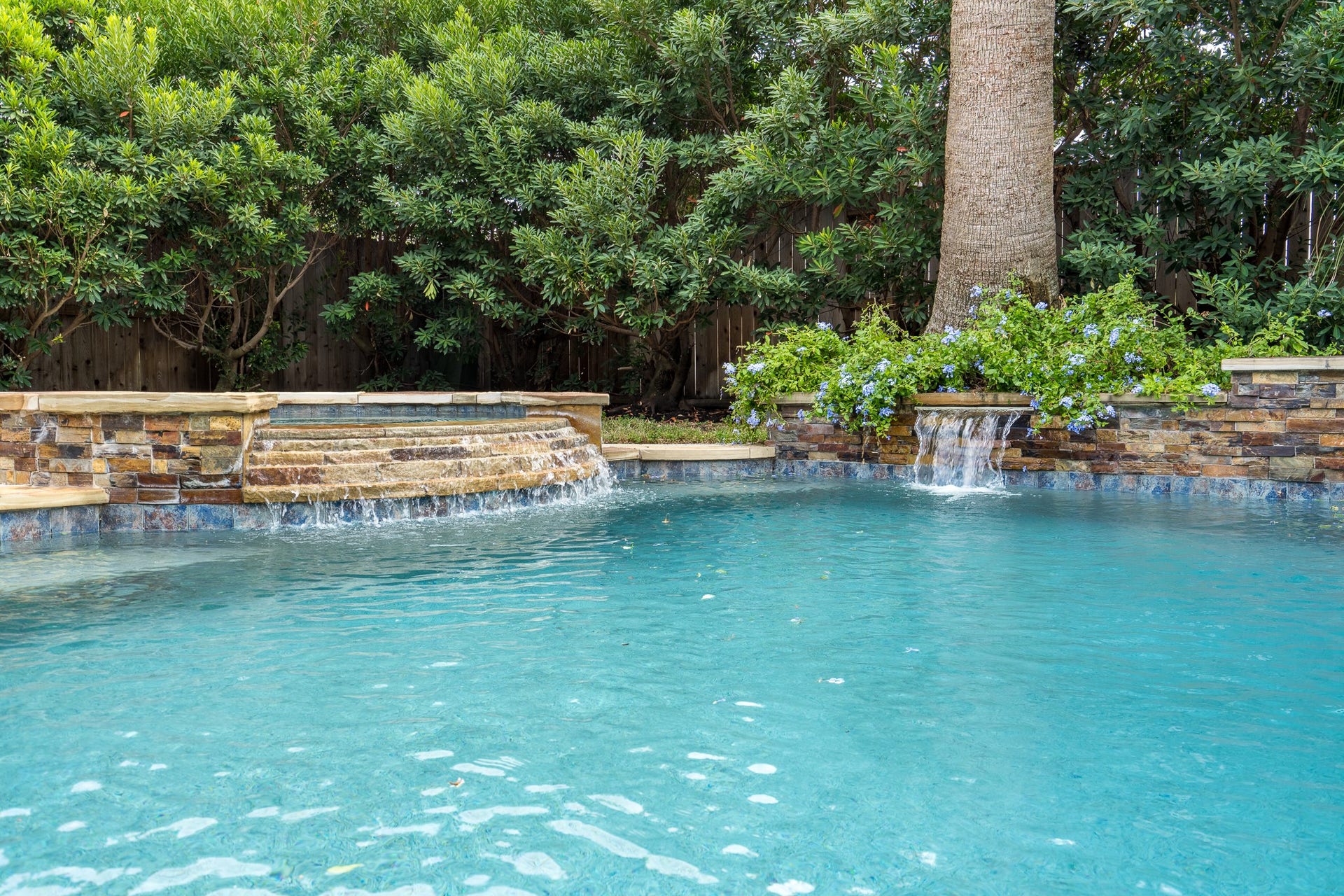 Ahhh! Nothing better than the soothing sound of waterfalls to help you relax in this amazing pool!
