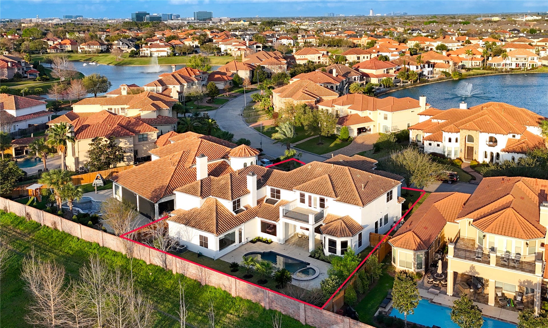 14014 Hampton Cove Drive, Houston, TX 77077 Stunning custom-built home situated on a prestigious street directly across from the lake, offering unparalleled curb appeal and an exceptional location.