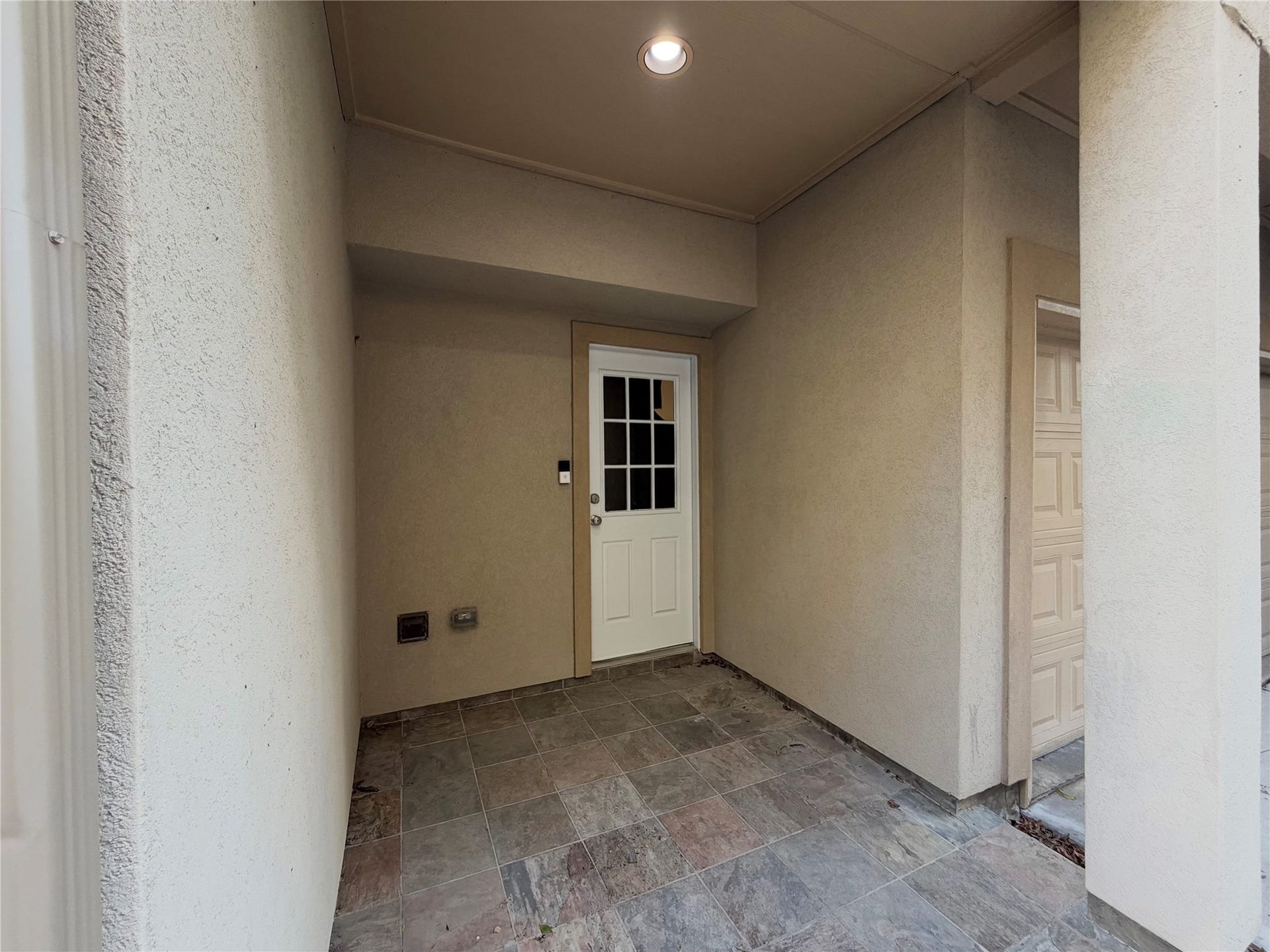2118 Holman Street, Houston, TX 77004 Entry into the home from the driveway entry side.