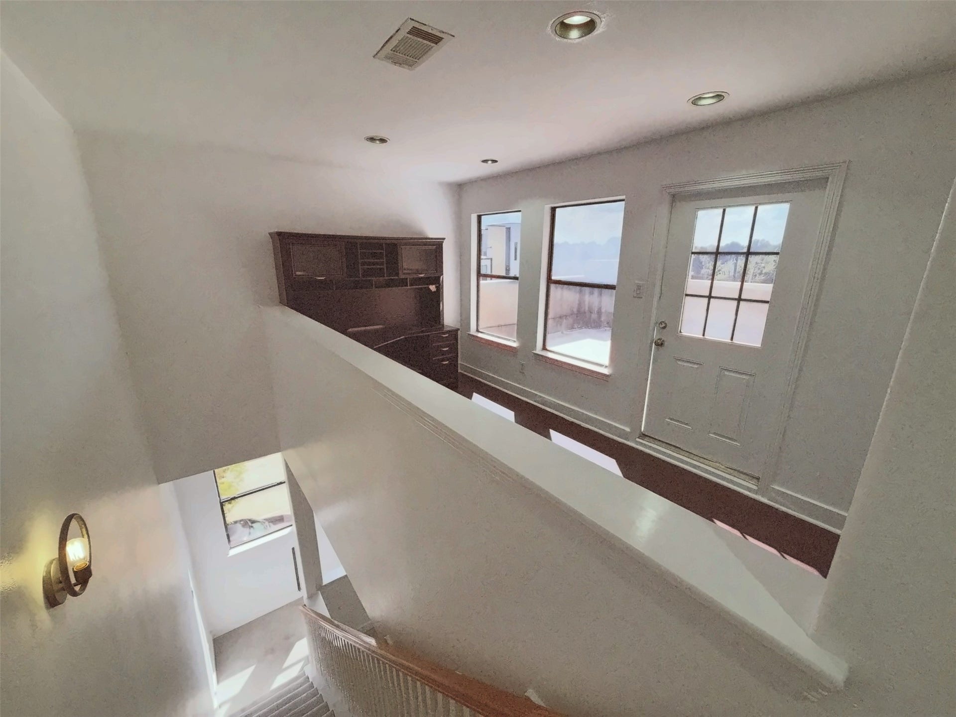 2118 Holman Street, Houston, TX 77004 Fourth floor landing area that could be a place for entertaining guest or office.