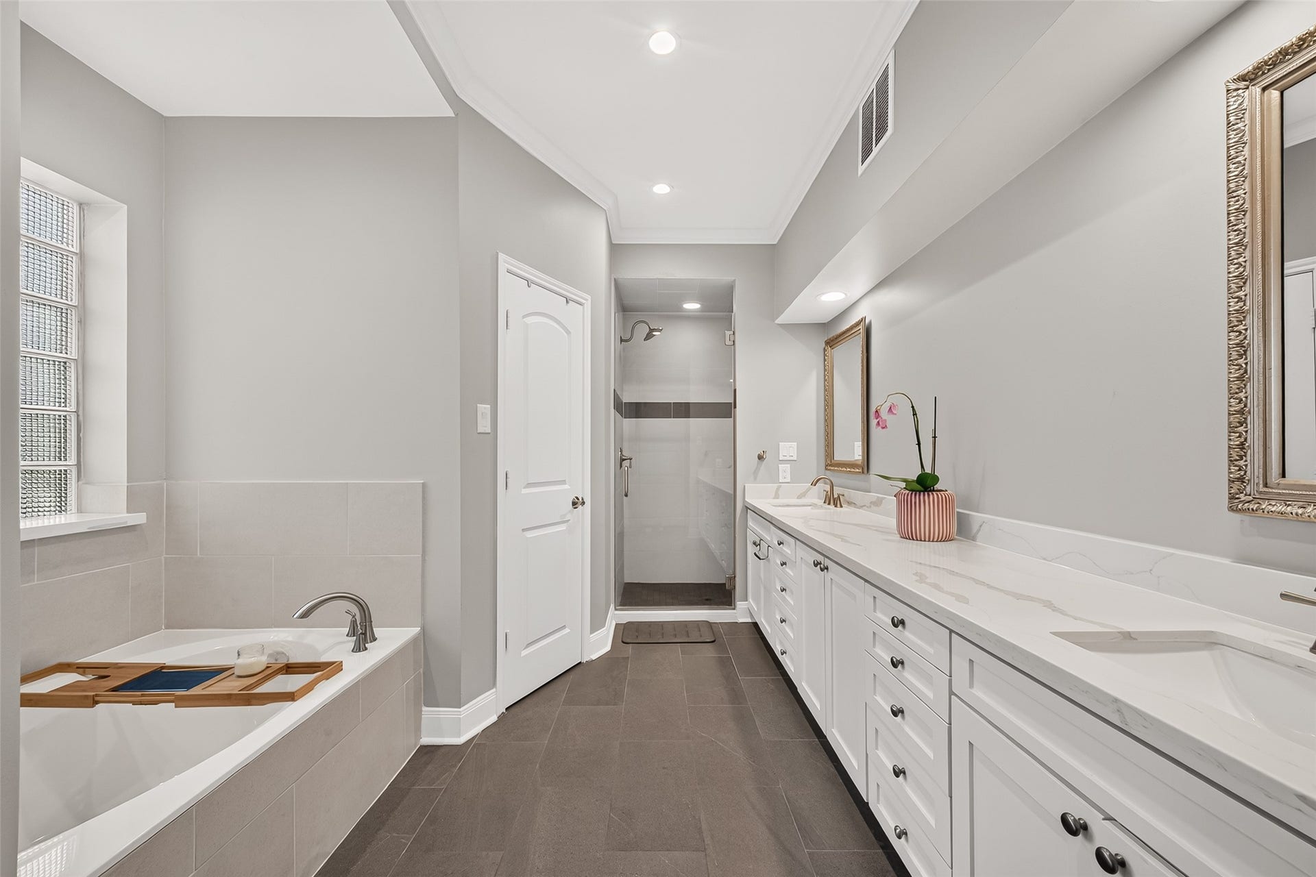 1122 Daria Drive, Houston, TX 77079 Primary bathroom has a soaking tub, separate shower, double sinks, and two walk in closets.