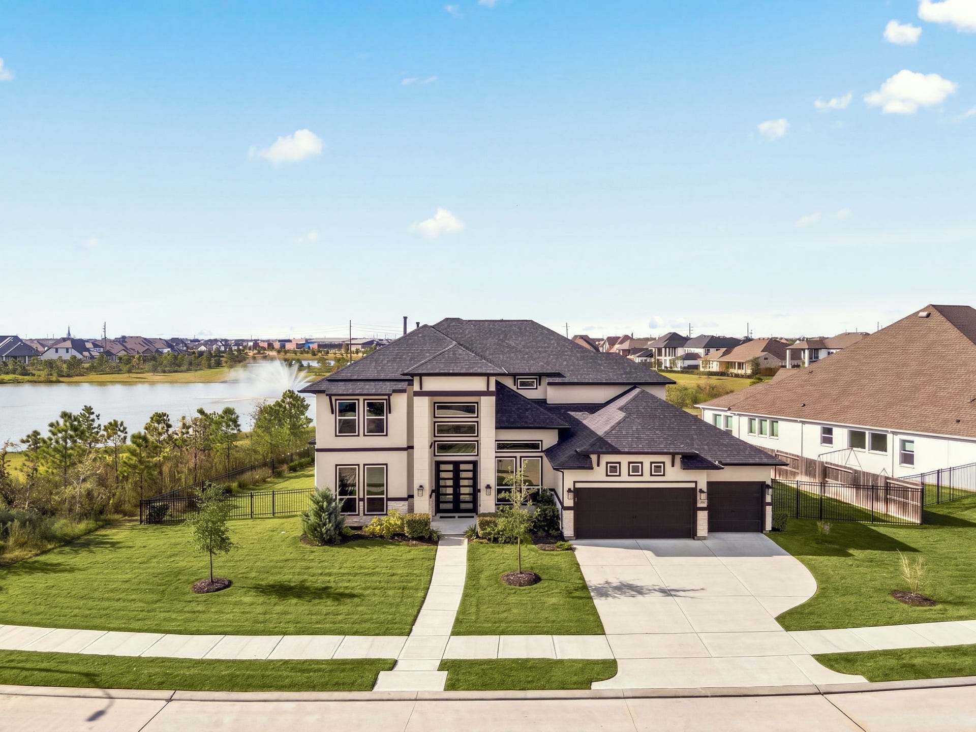3026 Emerald Field Lane, Fulshear, TX 77423 An elevated J. Patrick Homes exterior showcasing upgraded architectural details, striking curb appeal, and an impressive four-car garagewhere luxury, design, and functionality come together beautifully.