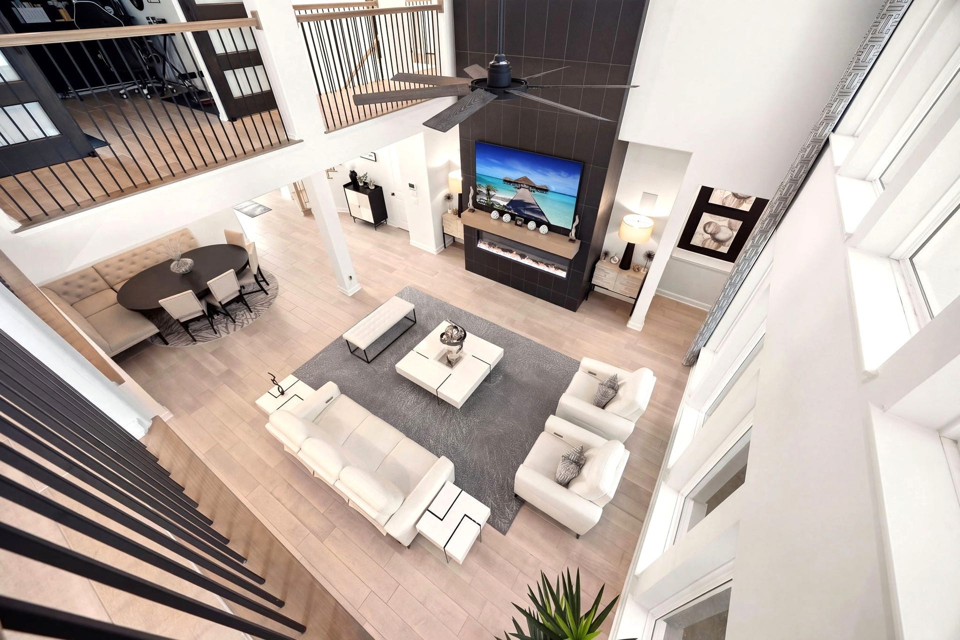 3026 Emerald Field Lane, Fulshear, TX 77423 An elevated view highlights the sleek electric fireplace, floating mantel, and custom floor-to-ceiling tilework, creating a striking modern focal point that adds depth, texture, and upscale sophistication to the living space.