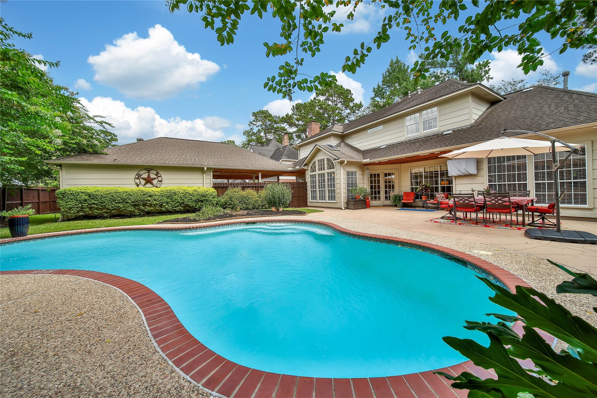 The backyard is part of the living spaceprivate pool, covered outdoor areas and room to gather year-round.