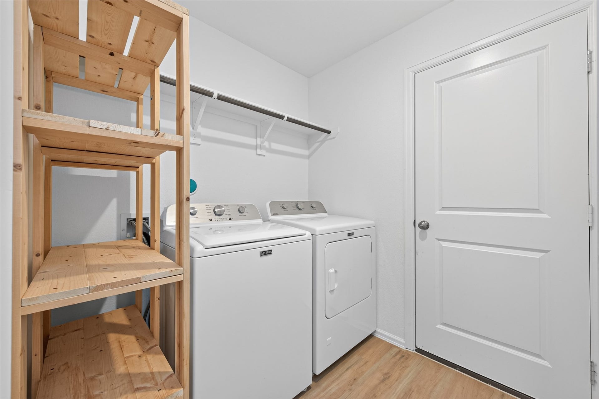 Washer and Dryer Room with Custom Built in Shelves
