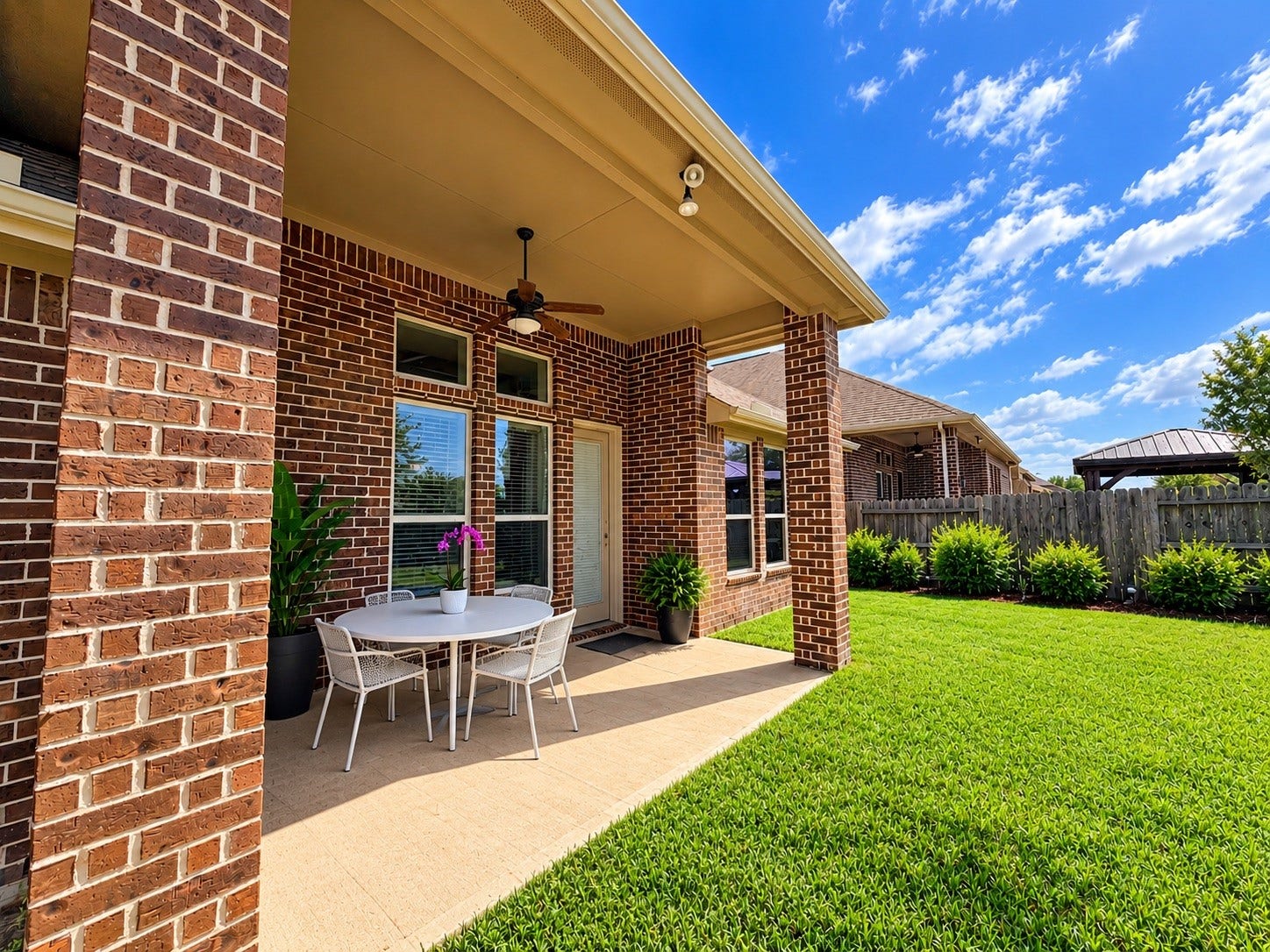 8006 Duncan Ranch Lane, Richmond, TX 77407 Enjoy outdoor living in this inviting backyard featuring a covered patio, perfect for relaxing, entertaining, or dining outdoors.