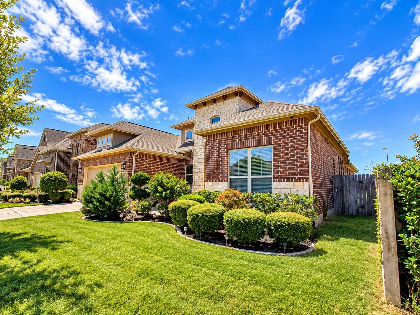 8006 Duncan Ranch Lane, Richmond, TX 77407 Beautiful landscaping, inviting first impression.
