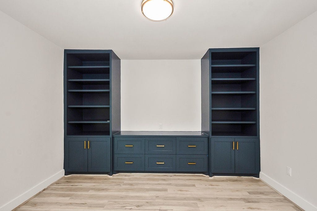 6106 Rutherglenn Drive, Houston, TX 77096 Built-in custom cabinetry and shelving adding style, storage, and functionality to the living space.