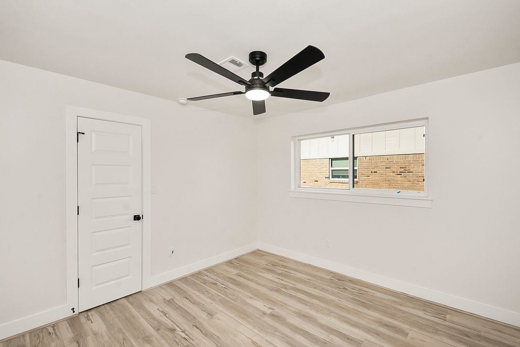 6106 Rutherglenn Drive, Houston, TX 77096 Secondary bedroom offering flexibility for guests, family, or a home office.