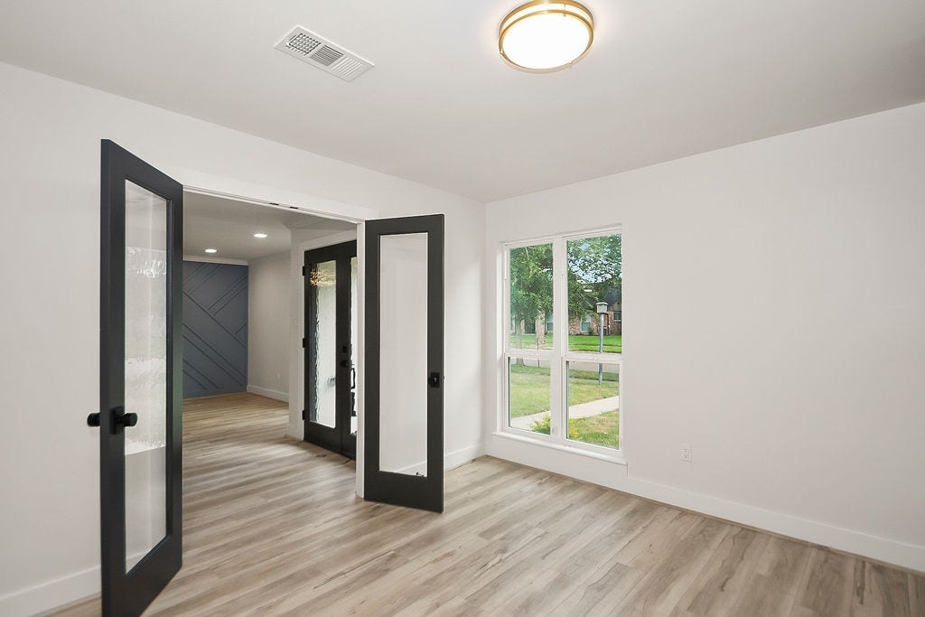 6106 Rutherglenn Drive, Houston, TX 77096 Spacious primary bedroom featuring modern finishes, abundant natural light, and direct access to the ensuite bath.