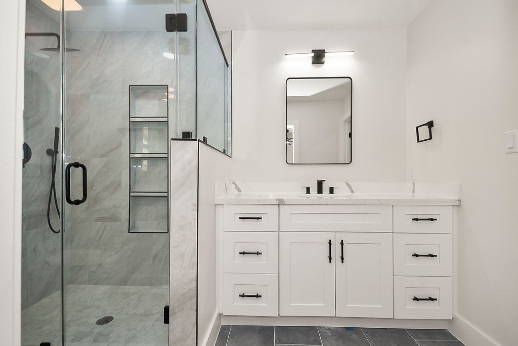 6106 Rutherglenn Drive, Houston, TX 77096 Another view of the stylishly renovated bathroom with designer finishes throughout.