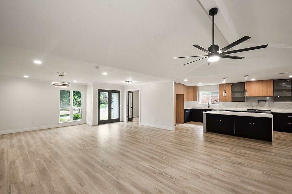 6106 Rutherglenn Drive, Houston, TX 77096 Open-concept kitchen and living area designed with modern finishes and abundant natural light.