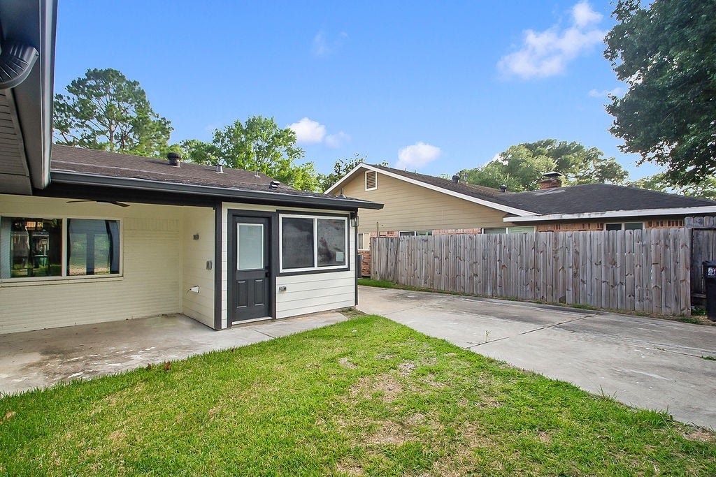 6106 Rutherglenn Drive, Houston, TX 77096 Private backyard patio area perfect for relaxing or entertaining outdoors.