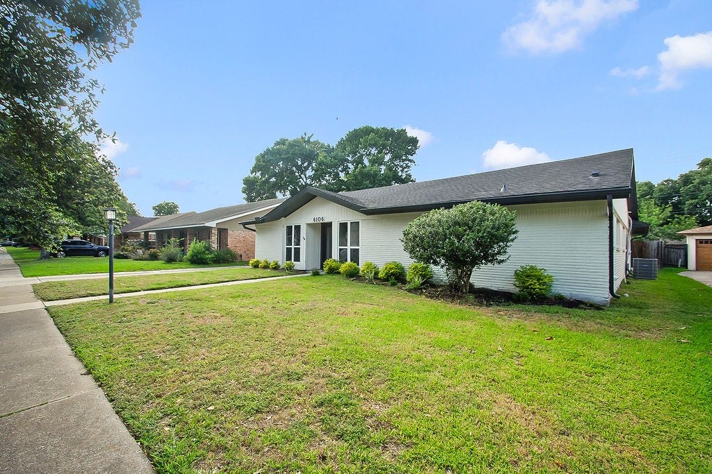 6106 Rutherglenn Drive, Houston, TX 77096 Another view of the beautifully updated exterior with modern design and mature landscaping.