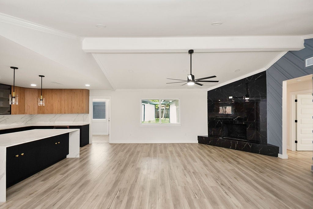 6106 Rutherglenn Drive, Houston, TX 77096 Another view of the expansive open-concept layout with vaulted ceilings and updated finishes throughout.