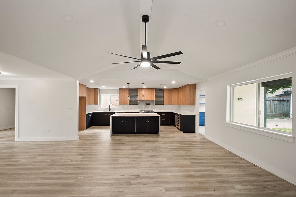 6106 Rutherglenn Drive, Houston, TX 77096 Spacious living and entertaining area offering effortless flow between the kitchen and living spaces.