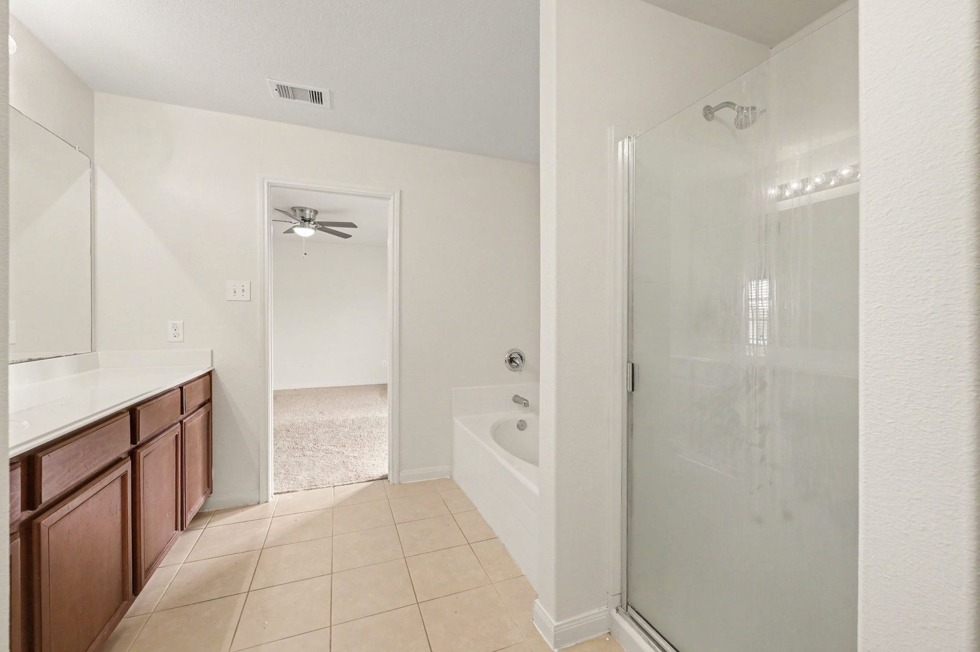 Spacious Primary Bathroom with separate stand-alone shower.