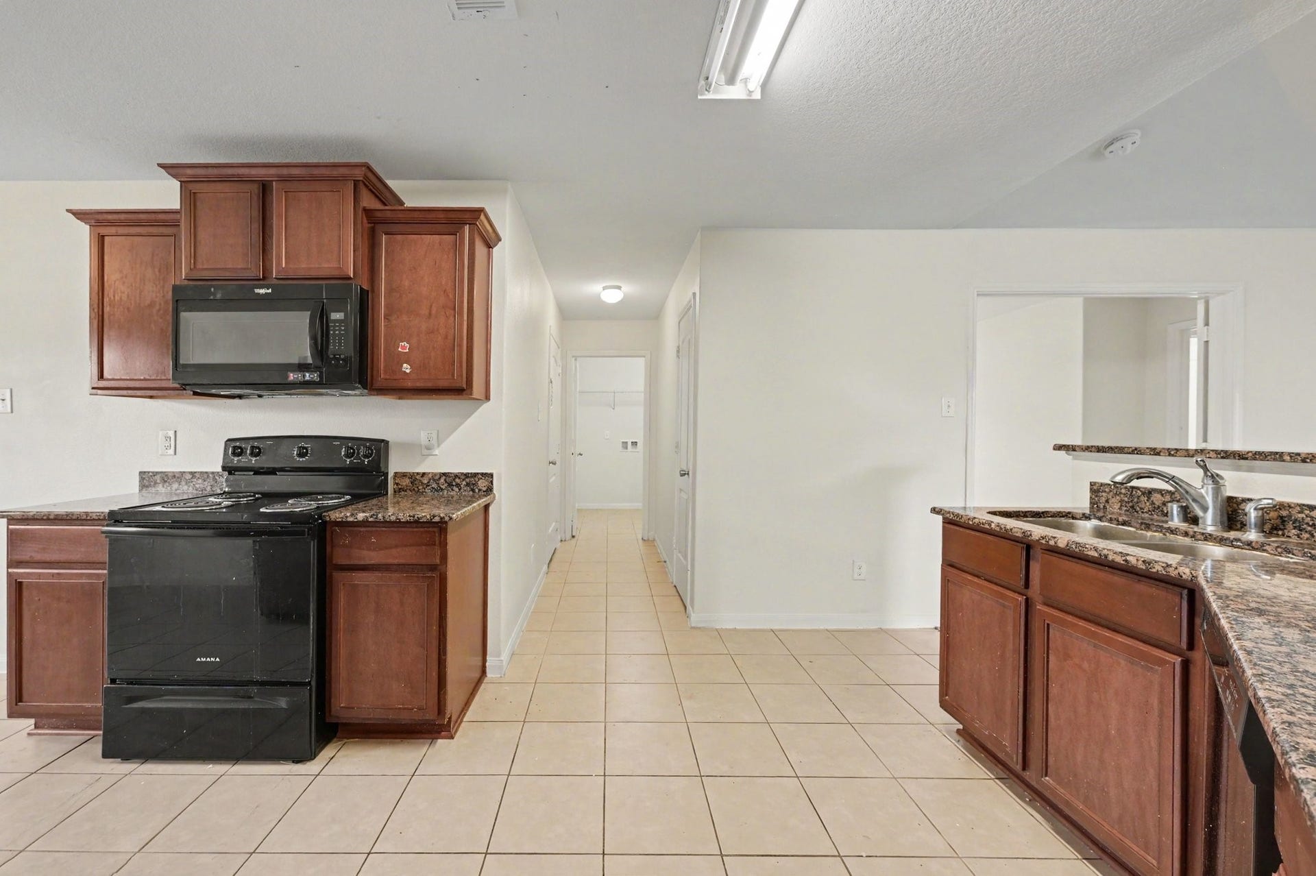 Inviting kitchen with rich wood cabinetry and plenty of counter space.