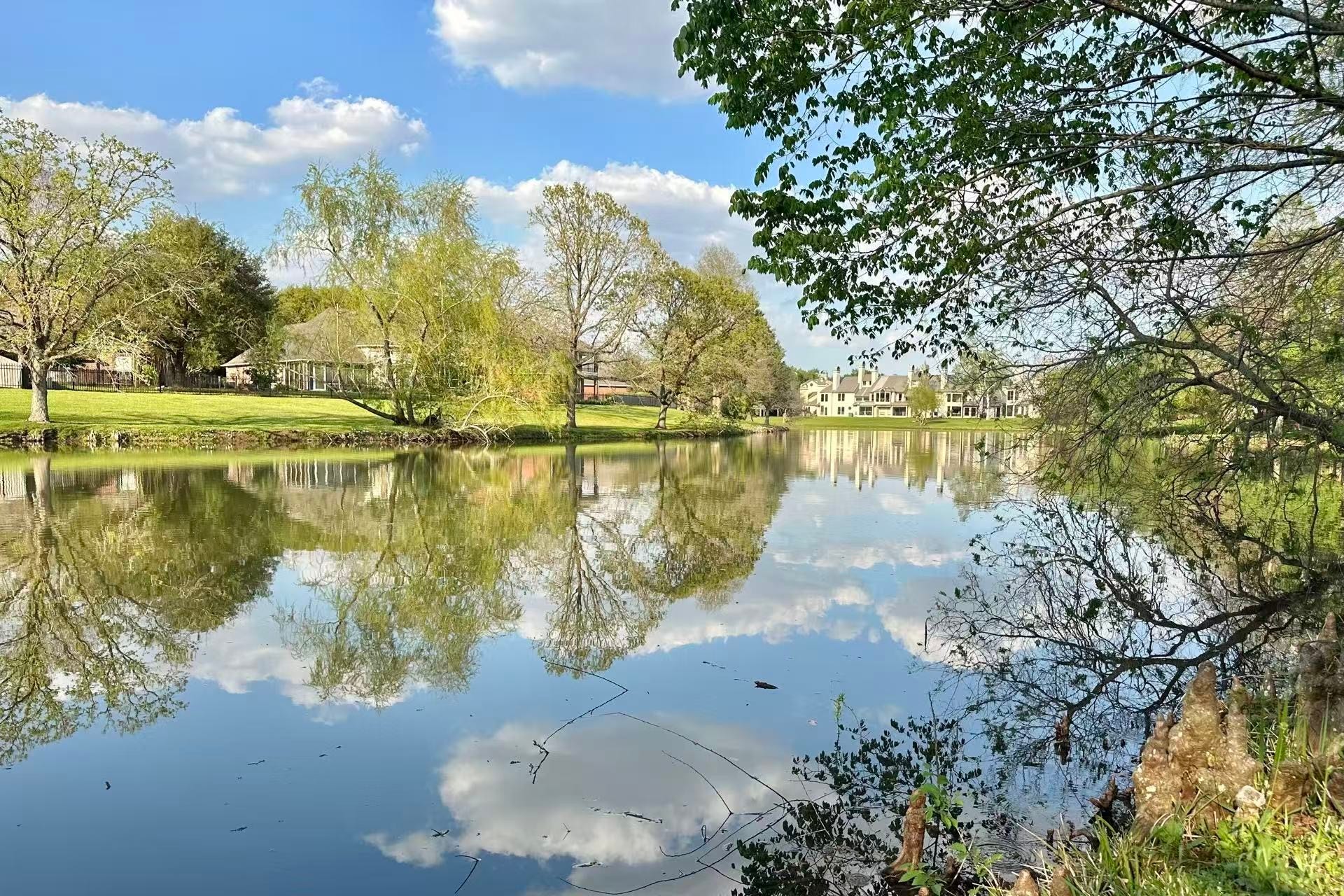 4311 Greystone Way, Sugar Land, TX 77479 The house nestled just steps away from this neighborhood lake. A tranquil environment for walking and bird watching.