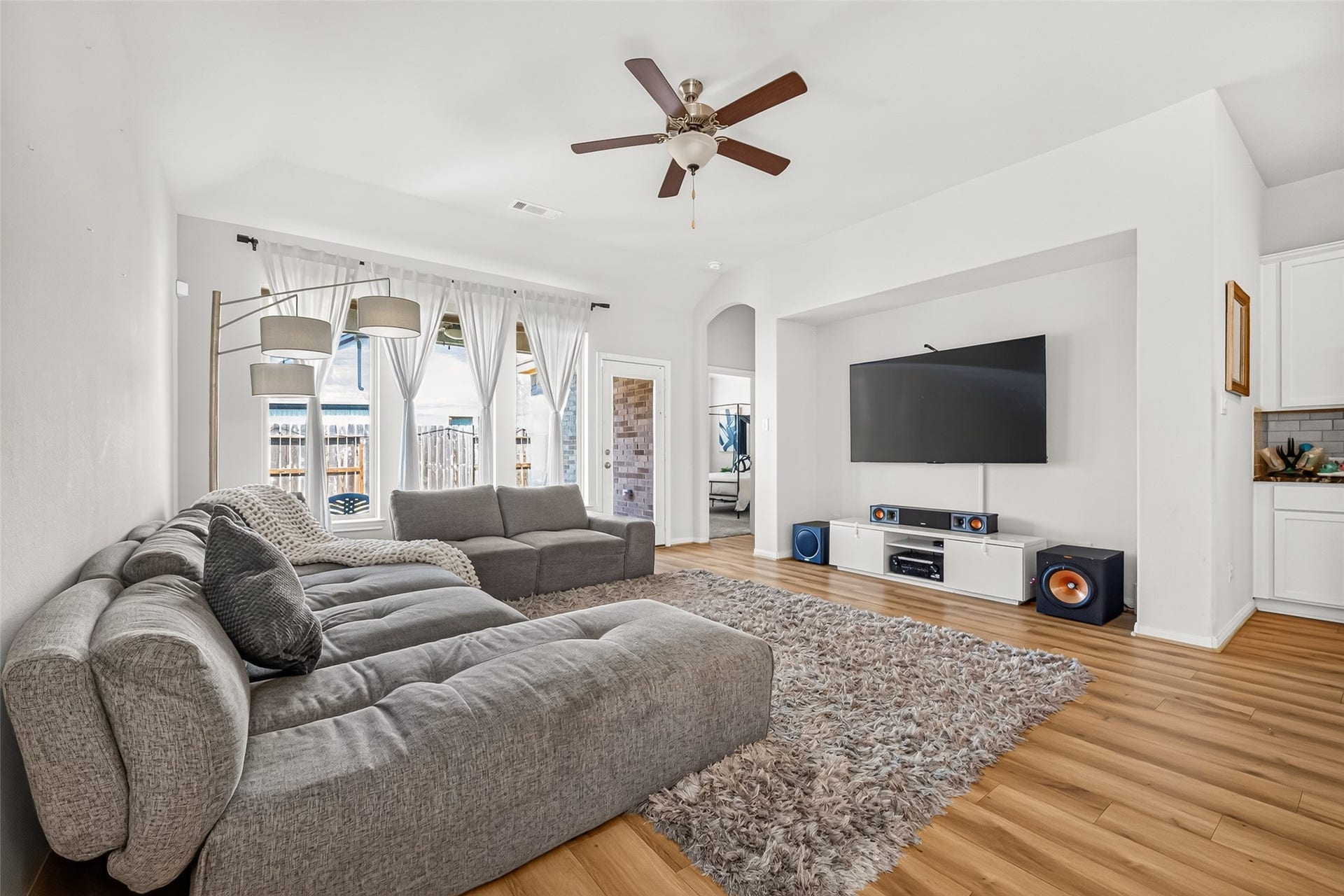 Living Room with Covered Back Patio Access and Large Windows giving tons of daylight