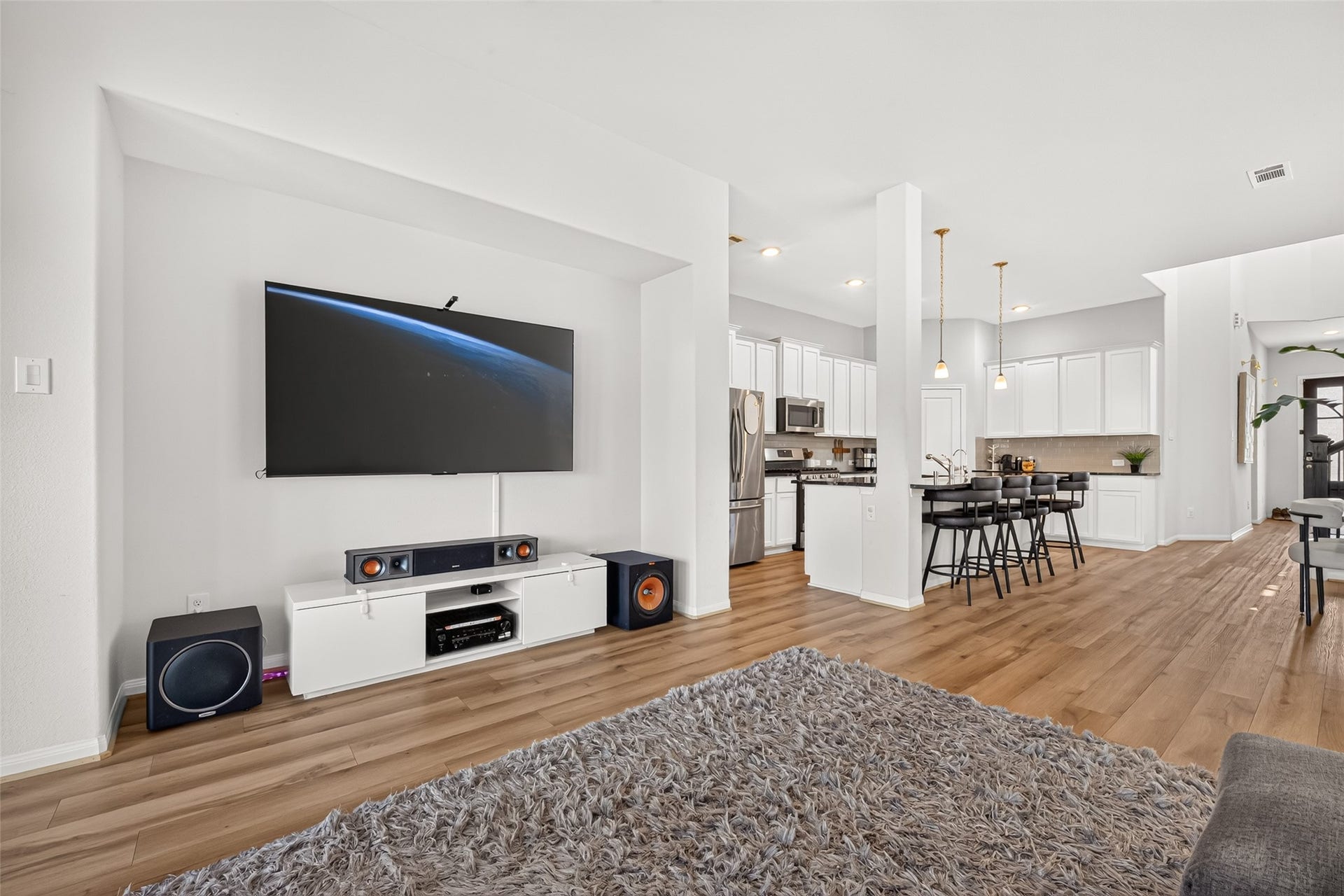 Living Room with Covered Back Patio Access and Large Windows giving tons of daylight