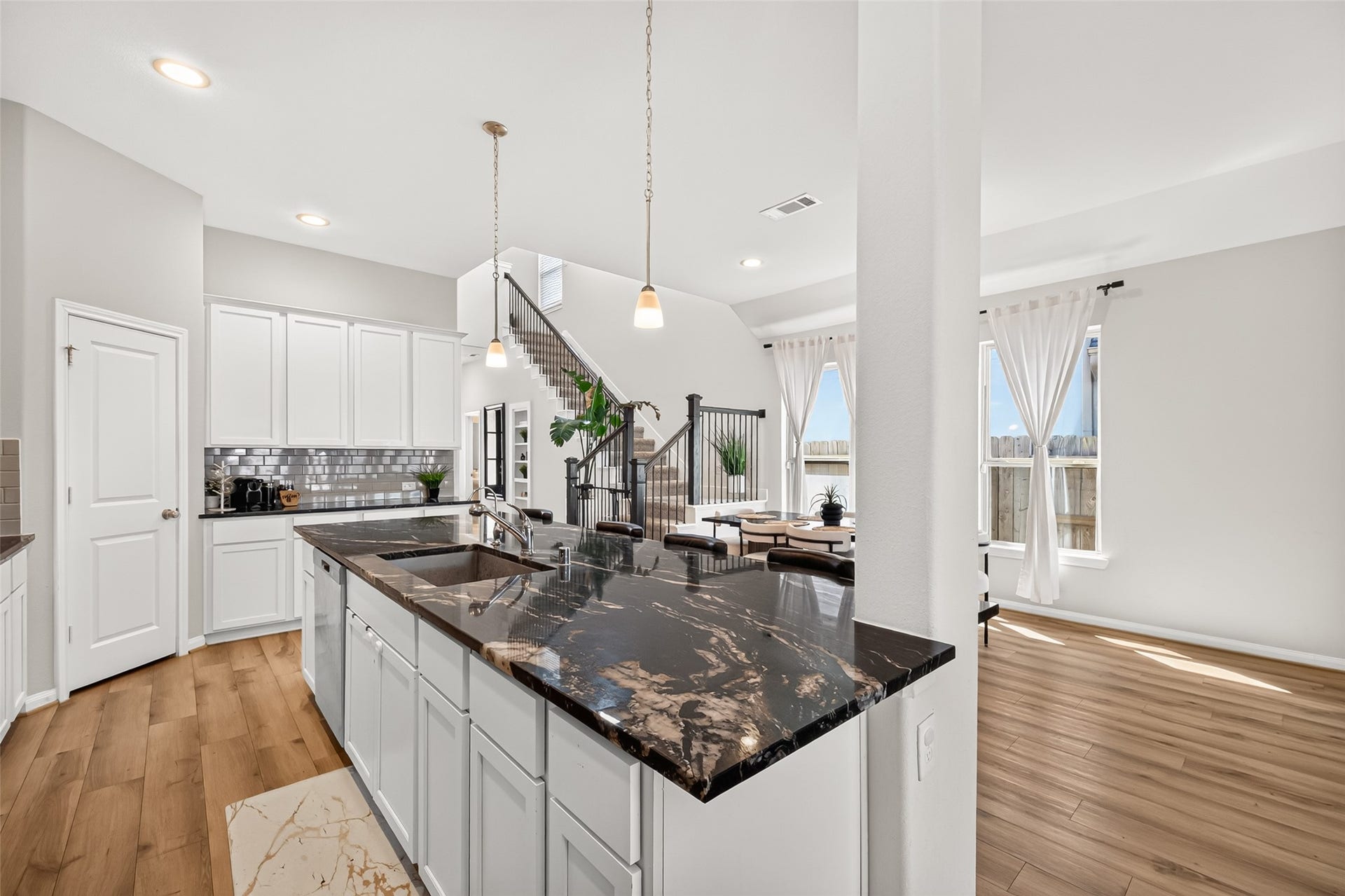 Open Concept Kitchen with Granite Counter Tops, SS Appliances and Large Serving Island amazing for entertaining.